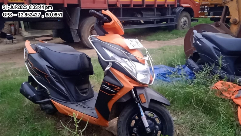 Dio scooty orange online colour images