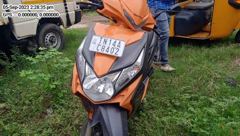 Orange colour dio online scooty